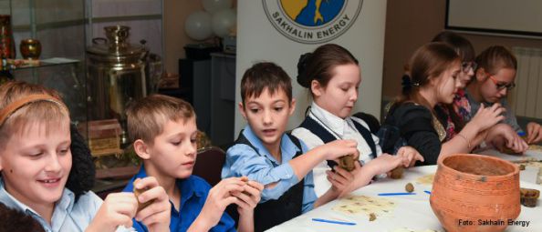 Children doing handicraft work with clay.