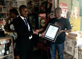Simeone Bansah receiving the citation of our Social Investment Fund. Photo: Eclipse Microfinance